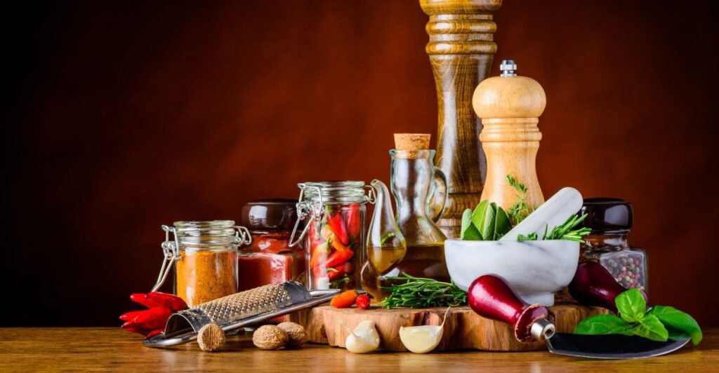 Mesa com de temperos essenciais da culinária. Lista de ingredientes de a a z.